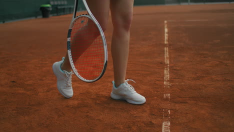 Woman-playing-tennis-fulfills-supply.-professionally-trains-tennis.-Young-pretty-girl-plays-tennis.-tennis-supply